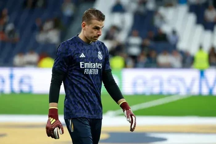 Goalkeeper in Real Madrid kit walking on pitch Goalkeeper in Real Madrid kit walking on pitch