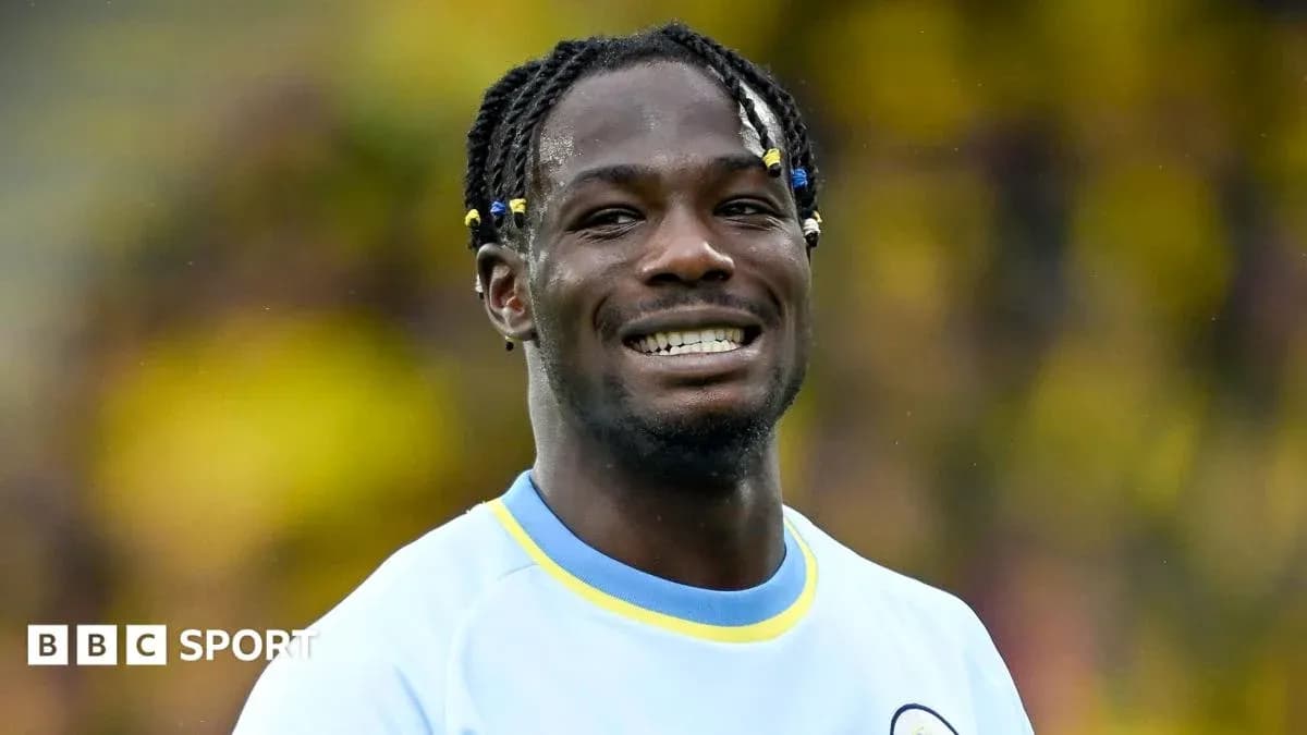 Player smiling while wearing a light blue jersey Player smiling while wearing a light blue jersey