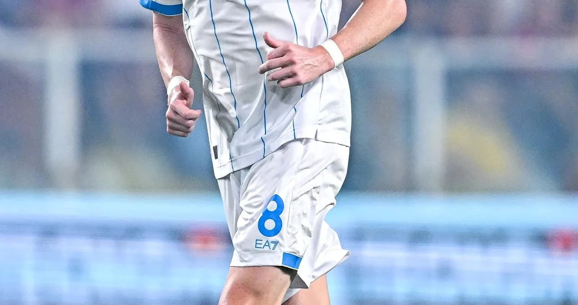 Player in Napoli kit running during a match Player in Napoli kit running during a match