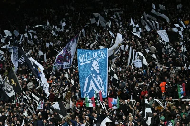 Newcastle United fans waving flags and banners Newcastle United fans waving flags and banners