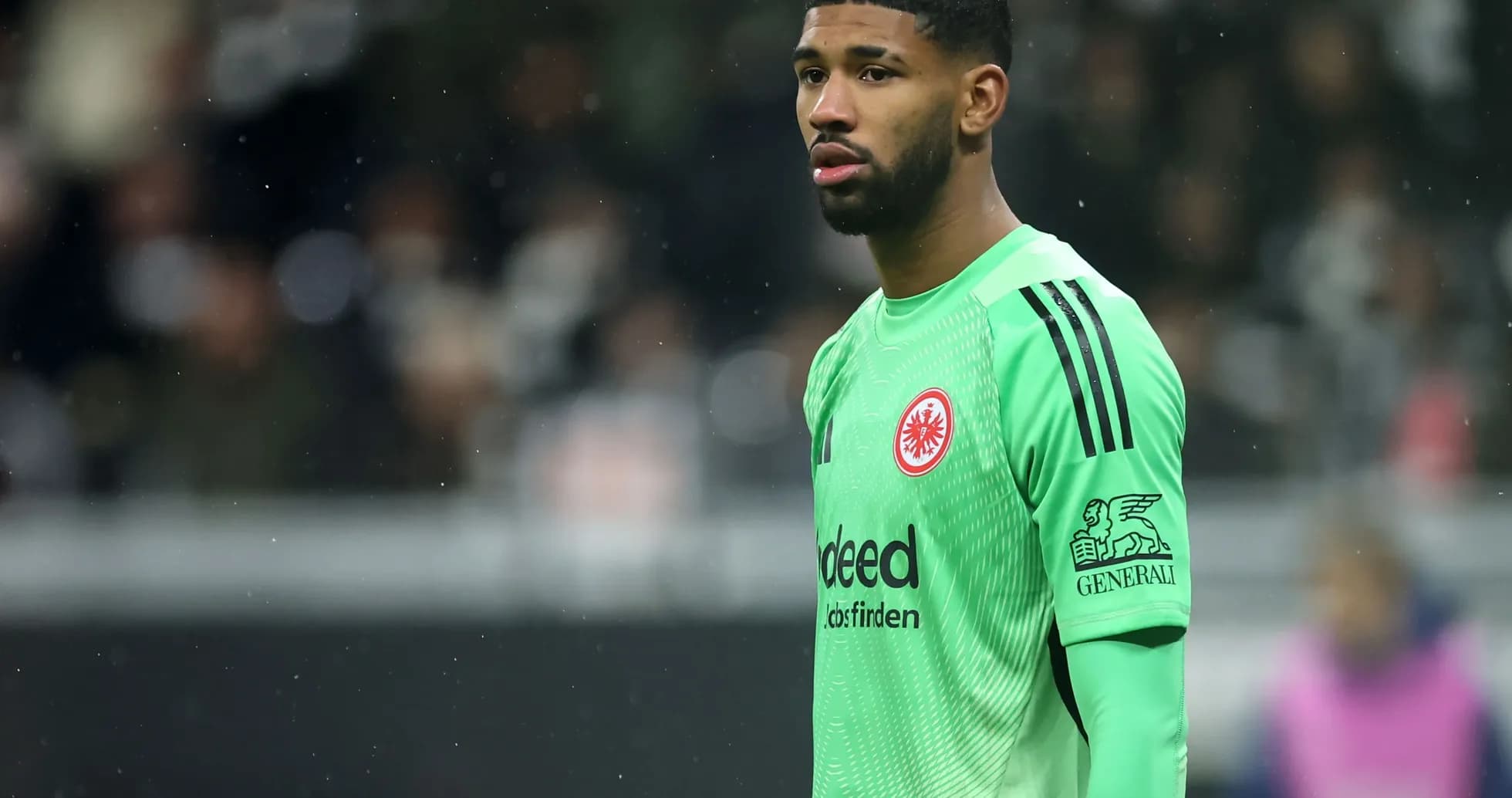 Goalkeeper wearing green kit during match Goalkeeper wearing green kit during match