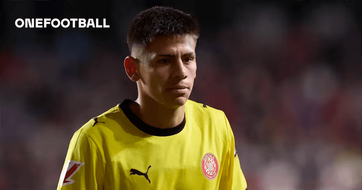 Goalkeeper in yellow jersey walking on field Goalkeeper in yellow jersey walking on field