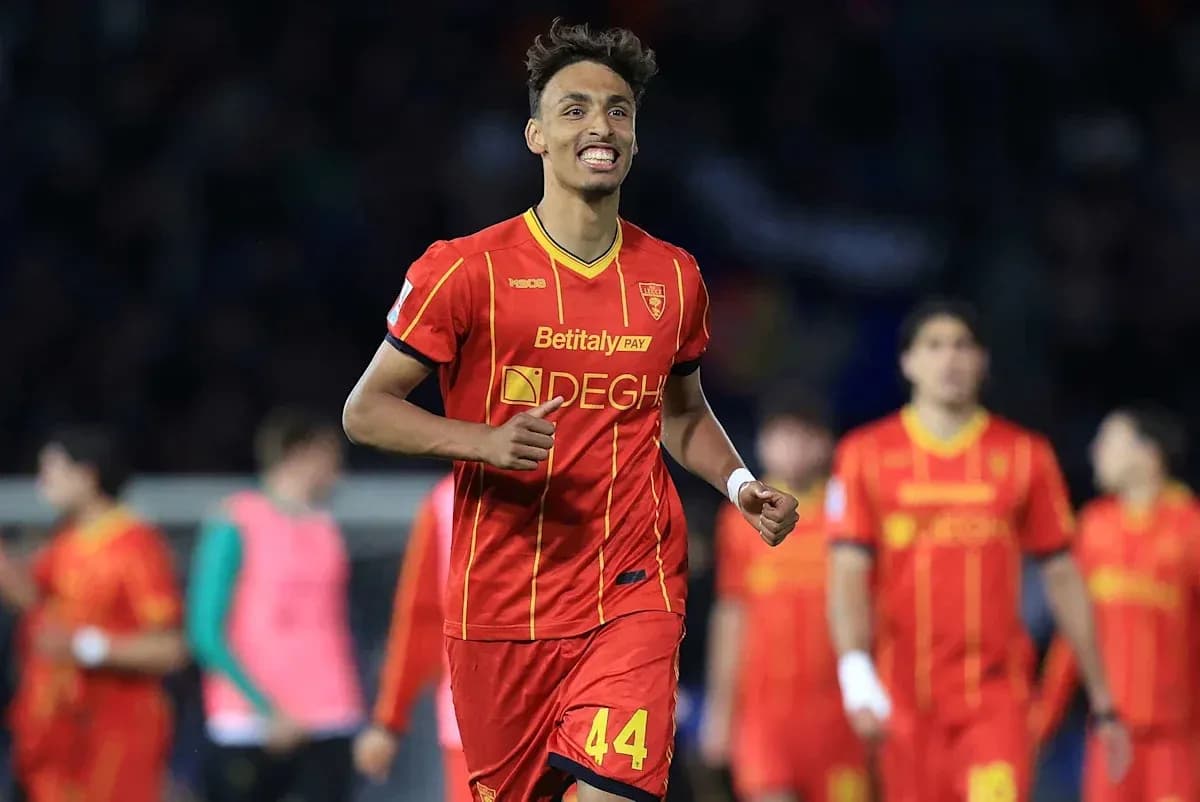Player celebrating in red jersey during match Player celebrating in red jersey during match