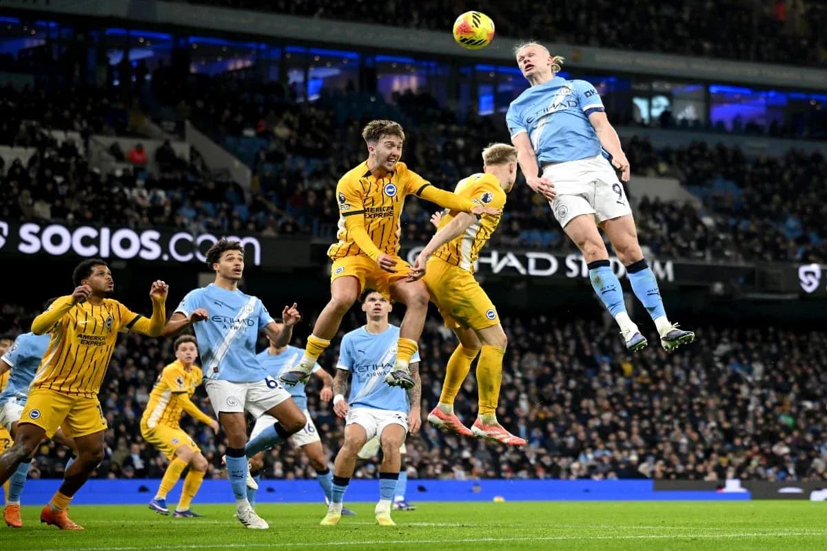 Erling Haaland jumping for a header in match Erling Haaland jumping for a header in match