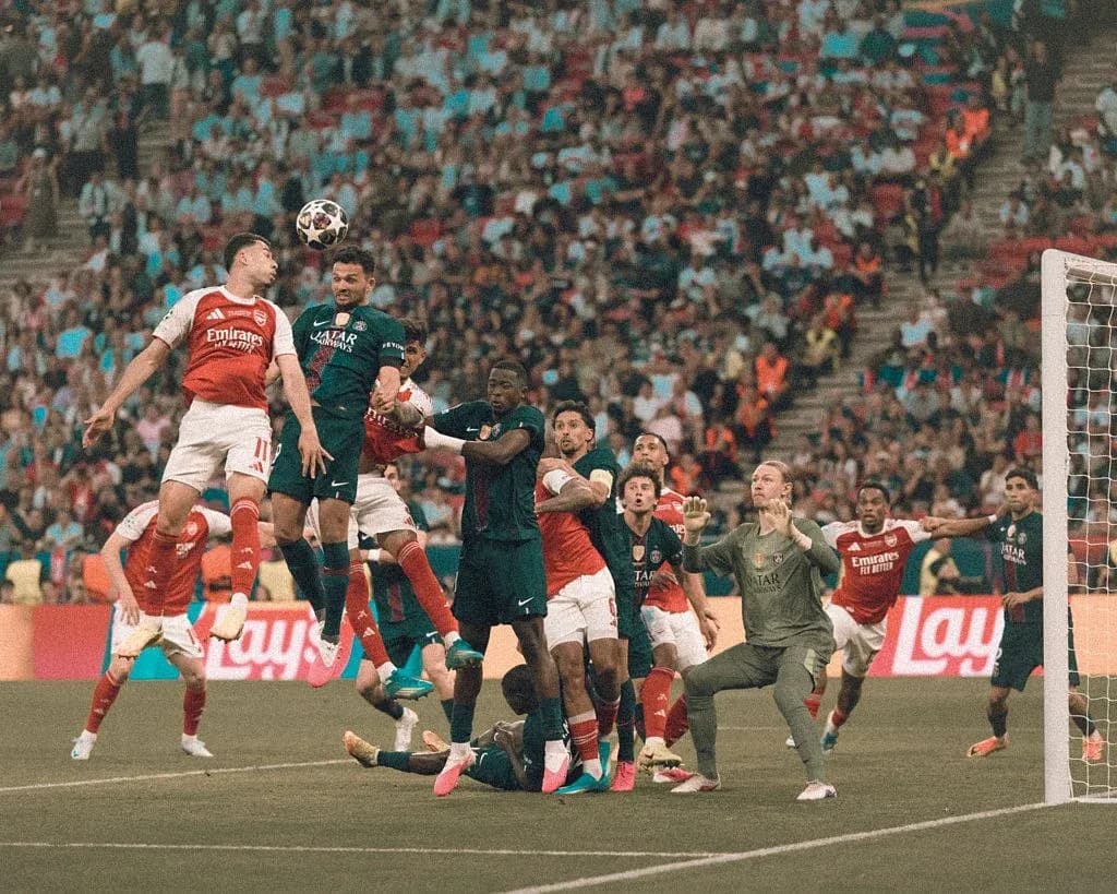 Players contesting a corner kick during match Players contesting a corner kick during match
