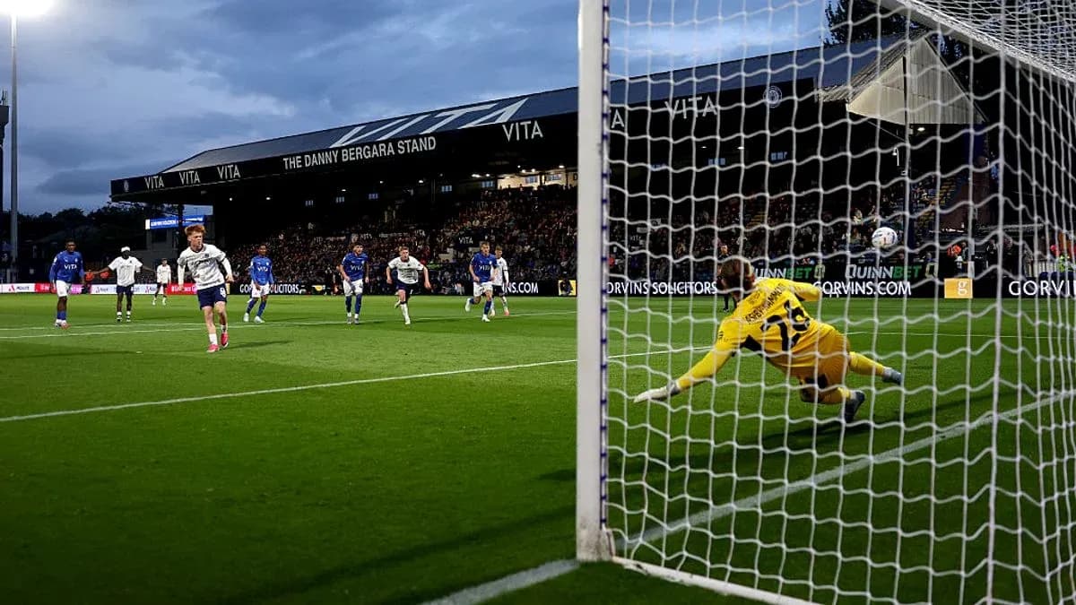 Player taking a penalty kick during a match Player taking a penalty kick during a match