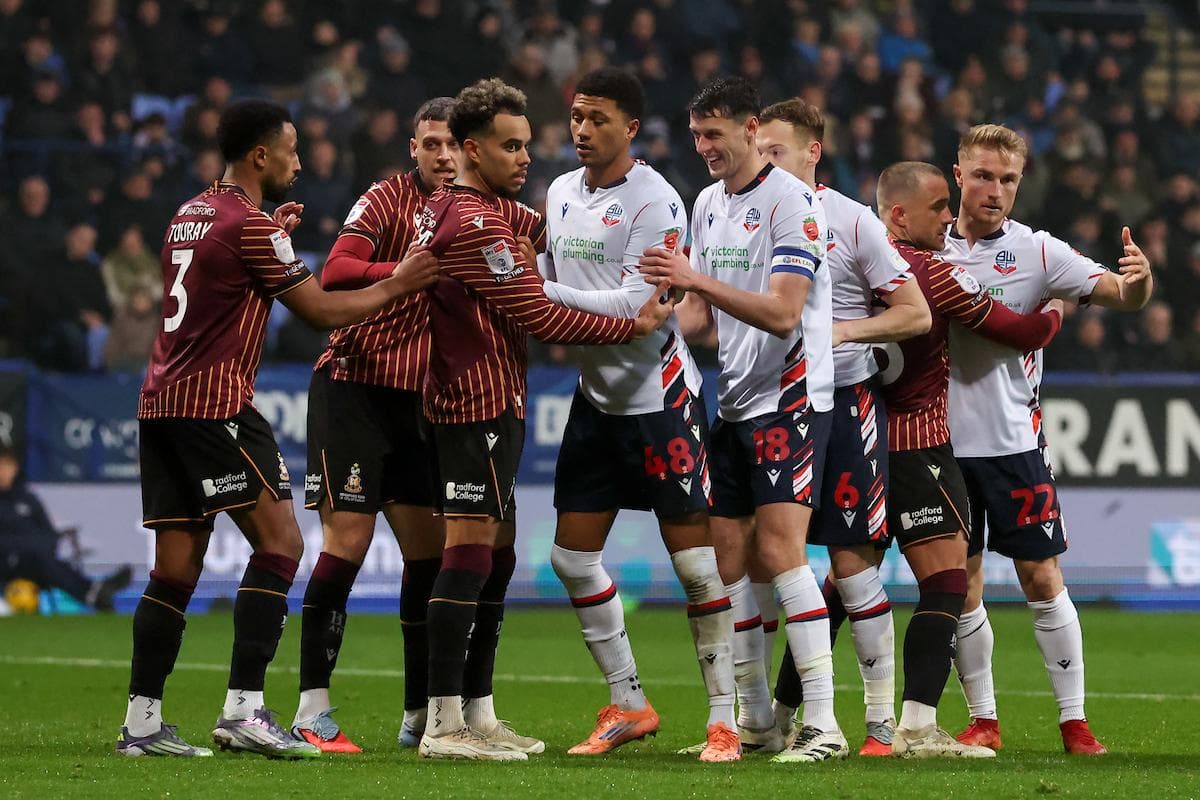 Players from both teams in a heated confrontation Players from both teams in a heated confrontation
