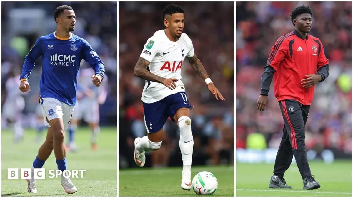 Three football players from different teams on pitch Three football players from different teams on pitch