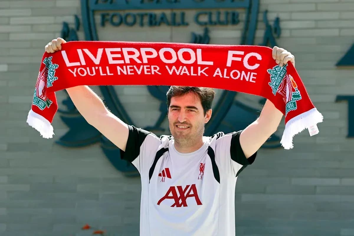 New player holding Liverpool FC scarf at announcement New player holding Liverpool FC scarf at announcement