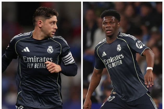 Two Real Madrid players in match uniforms Two Real Madrid players in match uniforms