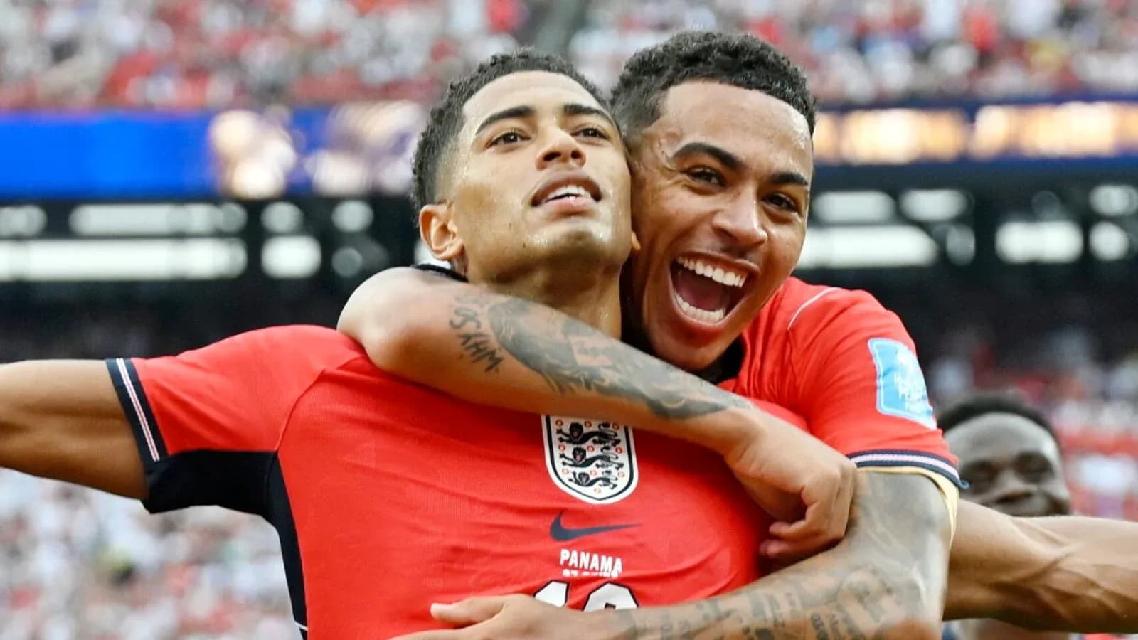 Two players celebrating a goal during match Two players celebrating a goal during match