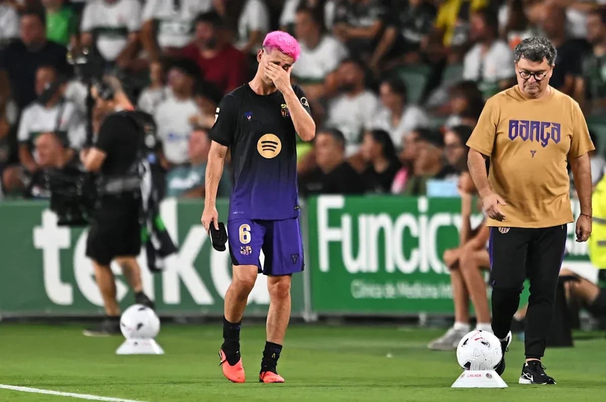Player with pink hair walking off field with coach Player with pink hair walking off field with coach