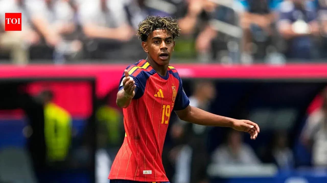Player in Spain kit signaling during match Player in Spain kit signaling during match