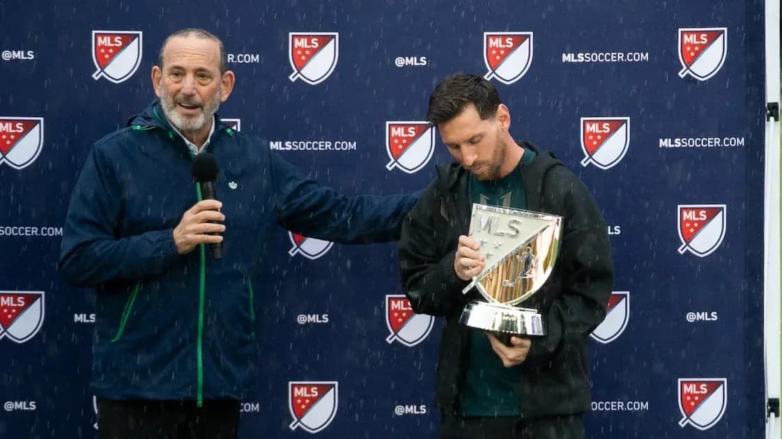 Speaker presenting trophy to player during ceremony Speaker presenting trophy to player during ceremony