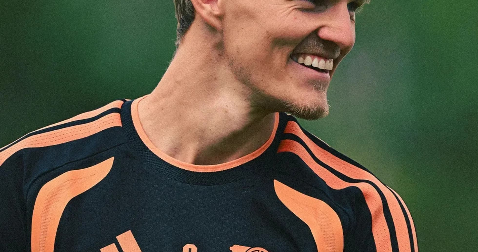 Player smiling in training kit at practice session Player smiling in training kit at practice session