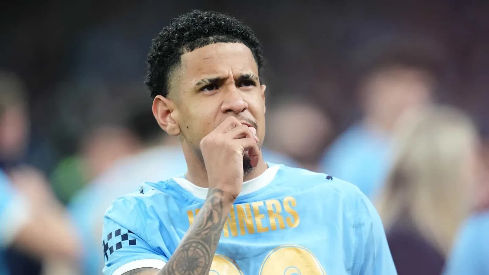 Player in light blue jersey contemplating on the field Player in light blue jersey contemplating on the field