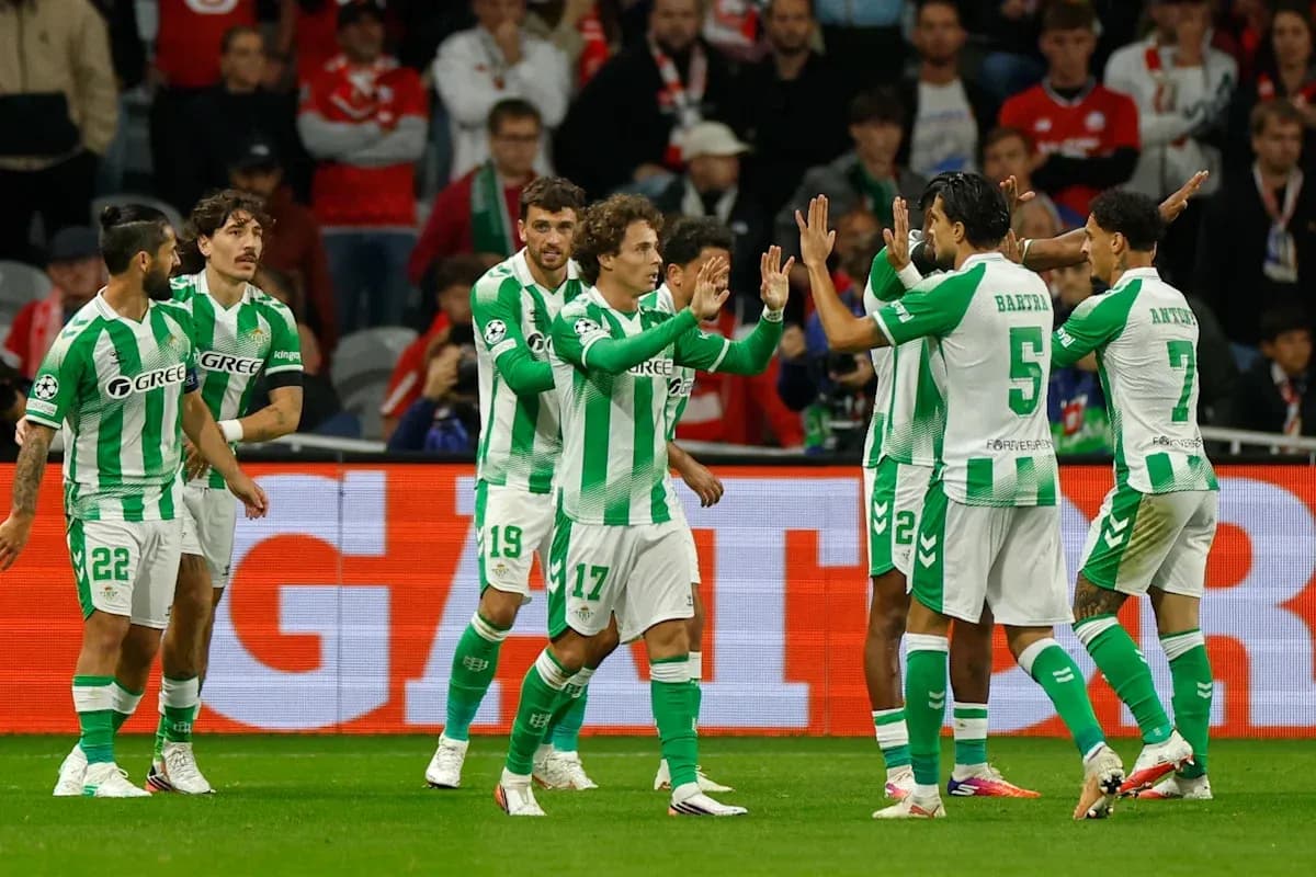 Real Betis players celebrating a goal together Real Betis players celebrating a goal together