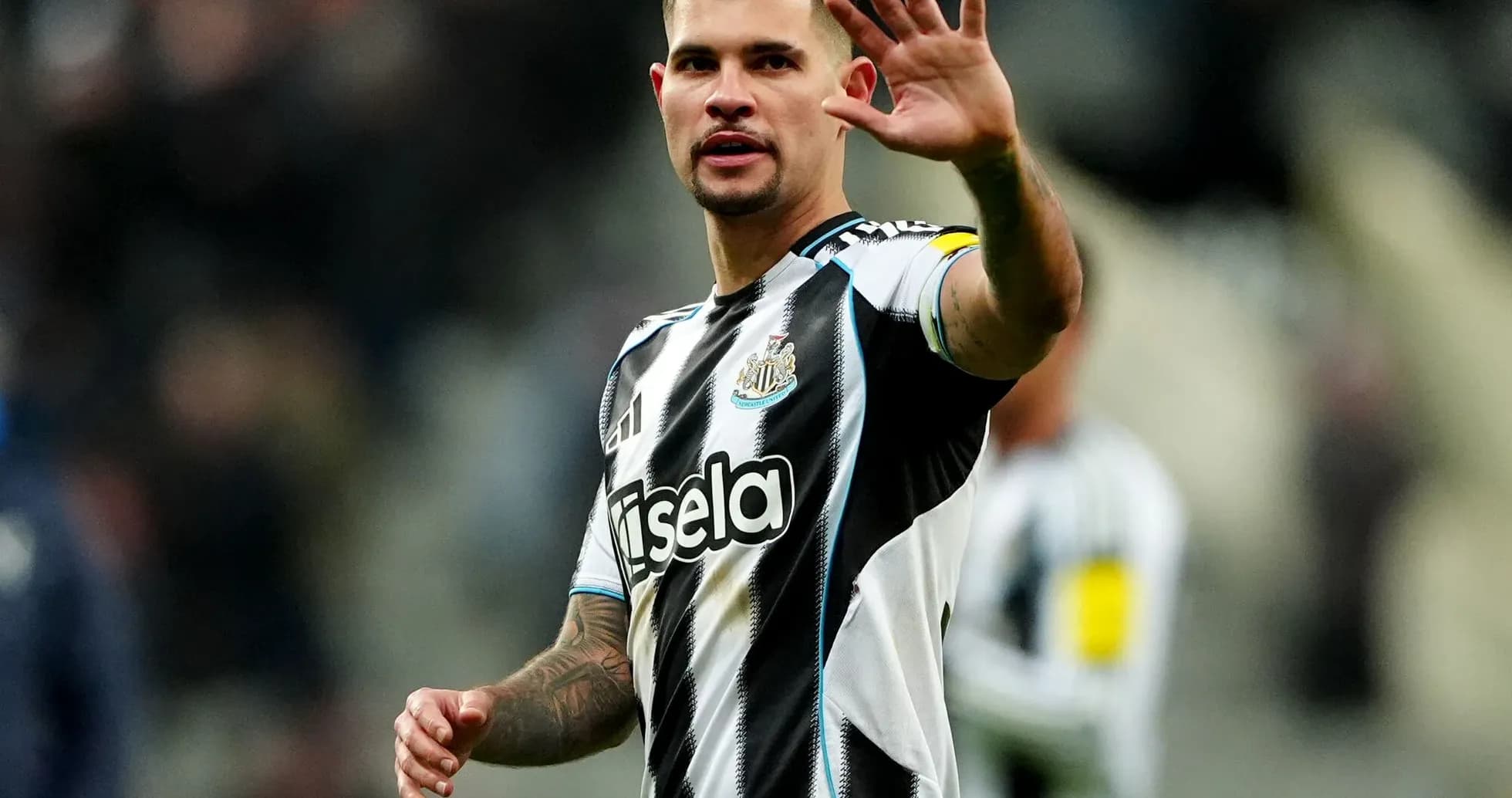 Newcastle player waving to the crowd during match Newcastle player waving to the crowd during match