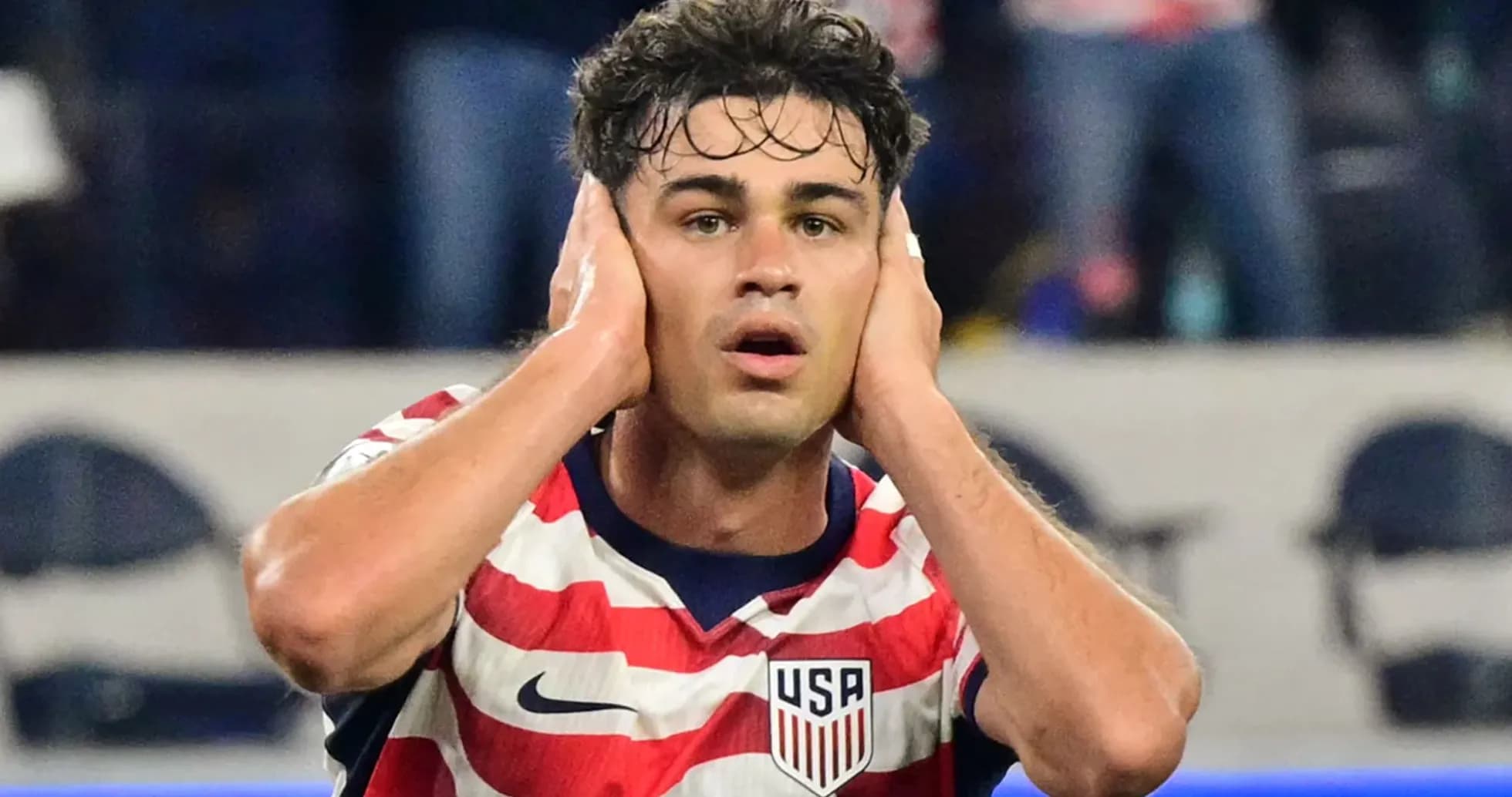Player holding head in frustration during match Player holding head in frustration during match