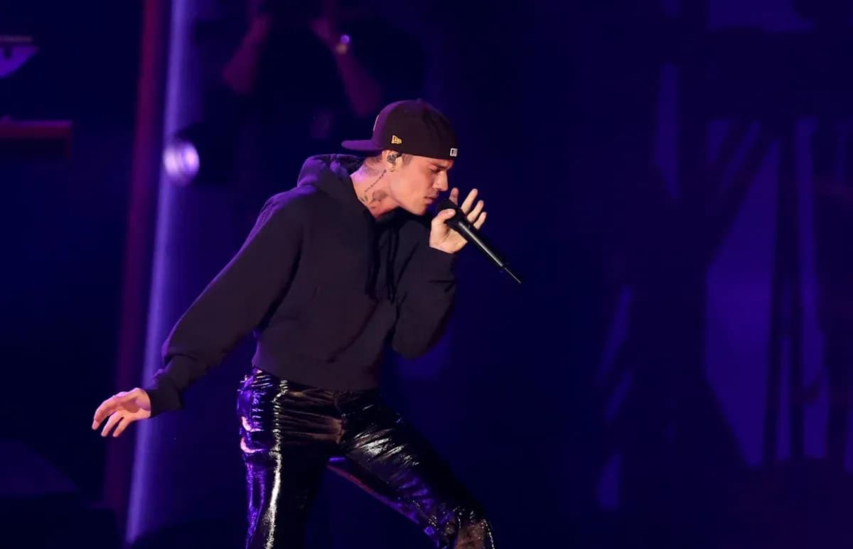 Performer singing on stage with microphone Performer singing on stage with microphone