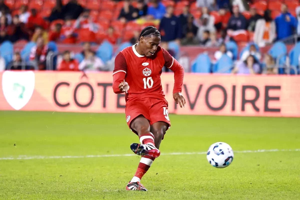 Player kicking ball during a soccer match Player kicking ball during a soccer match