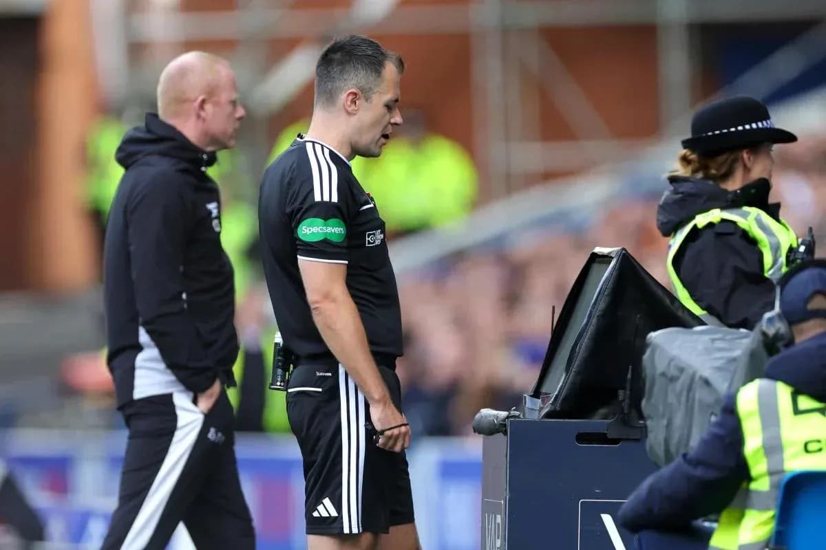 Referee reviewing a decision at VAR monitor Referee reviewing a decision at VAR monitor