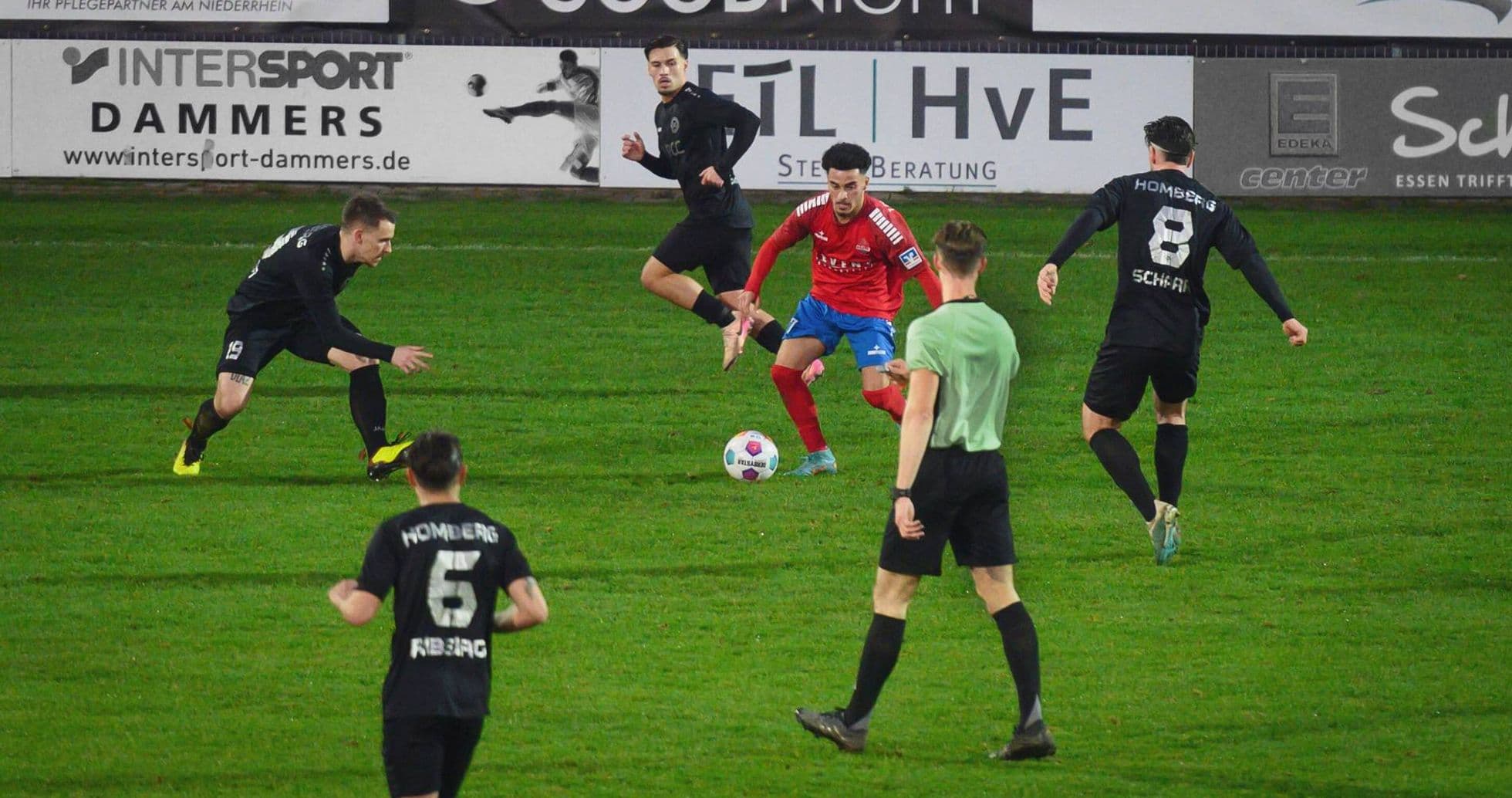 Players contesting for the ball in Oberliga match Players contesting for the ball in Oberliga match