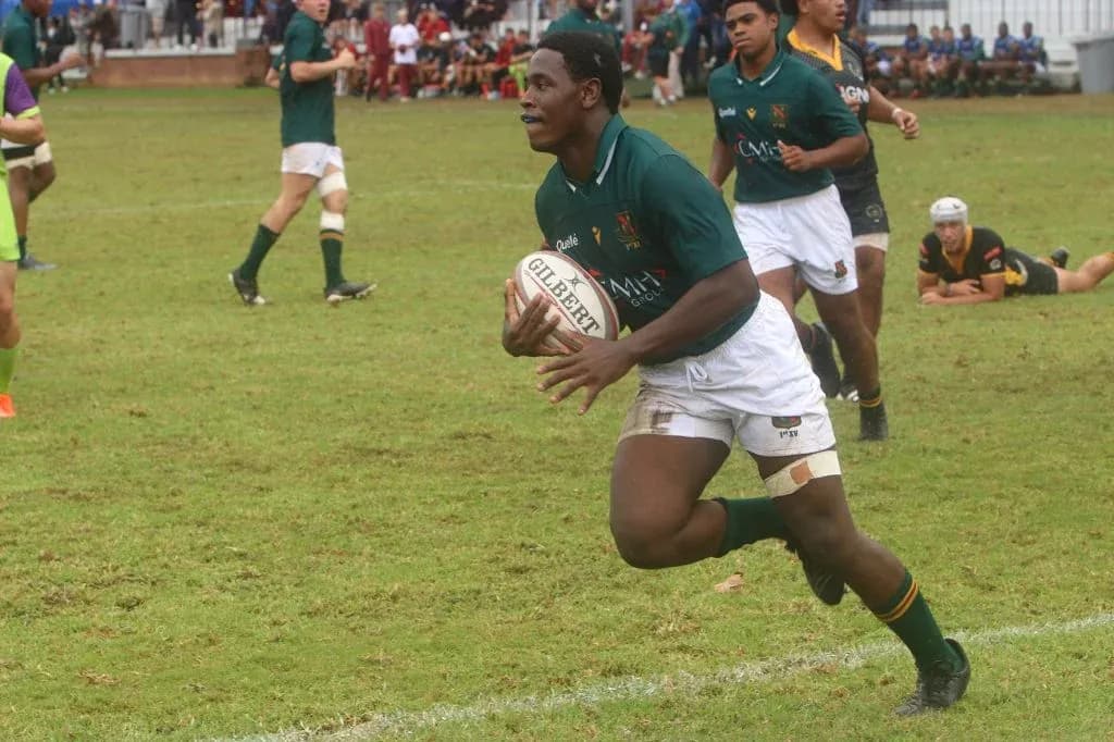 Player running with rugby ball during match Player running with rugby ball during match