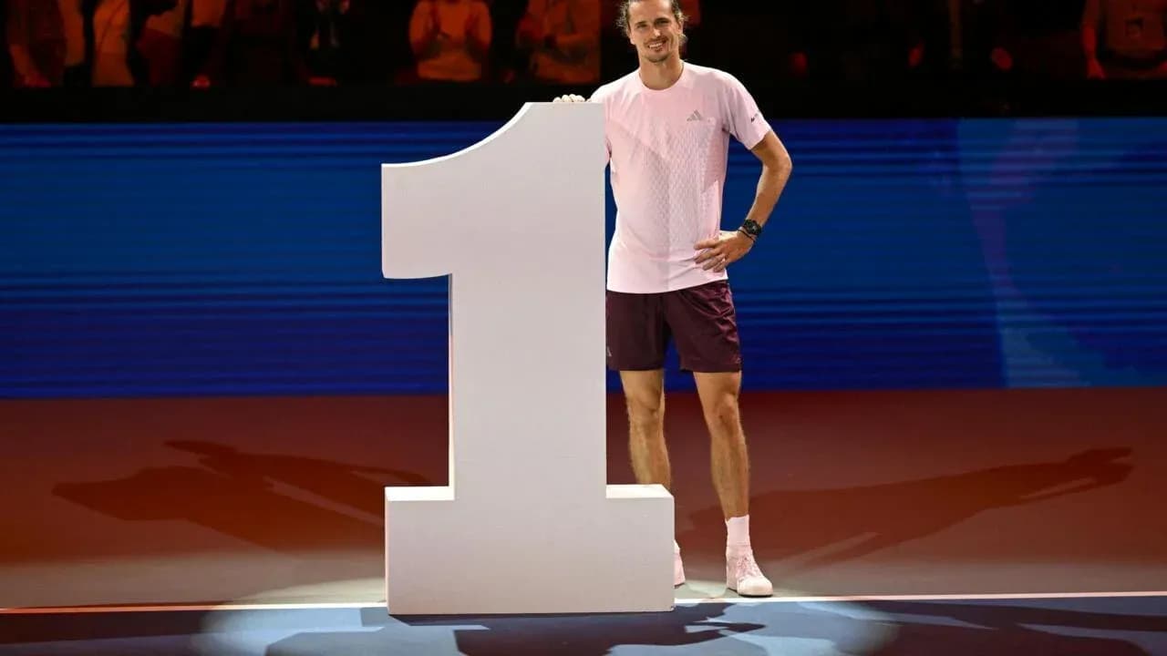 Player celebrating next to large number one sign Player celebrating next to large number one sign