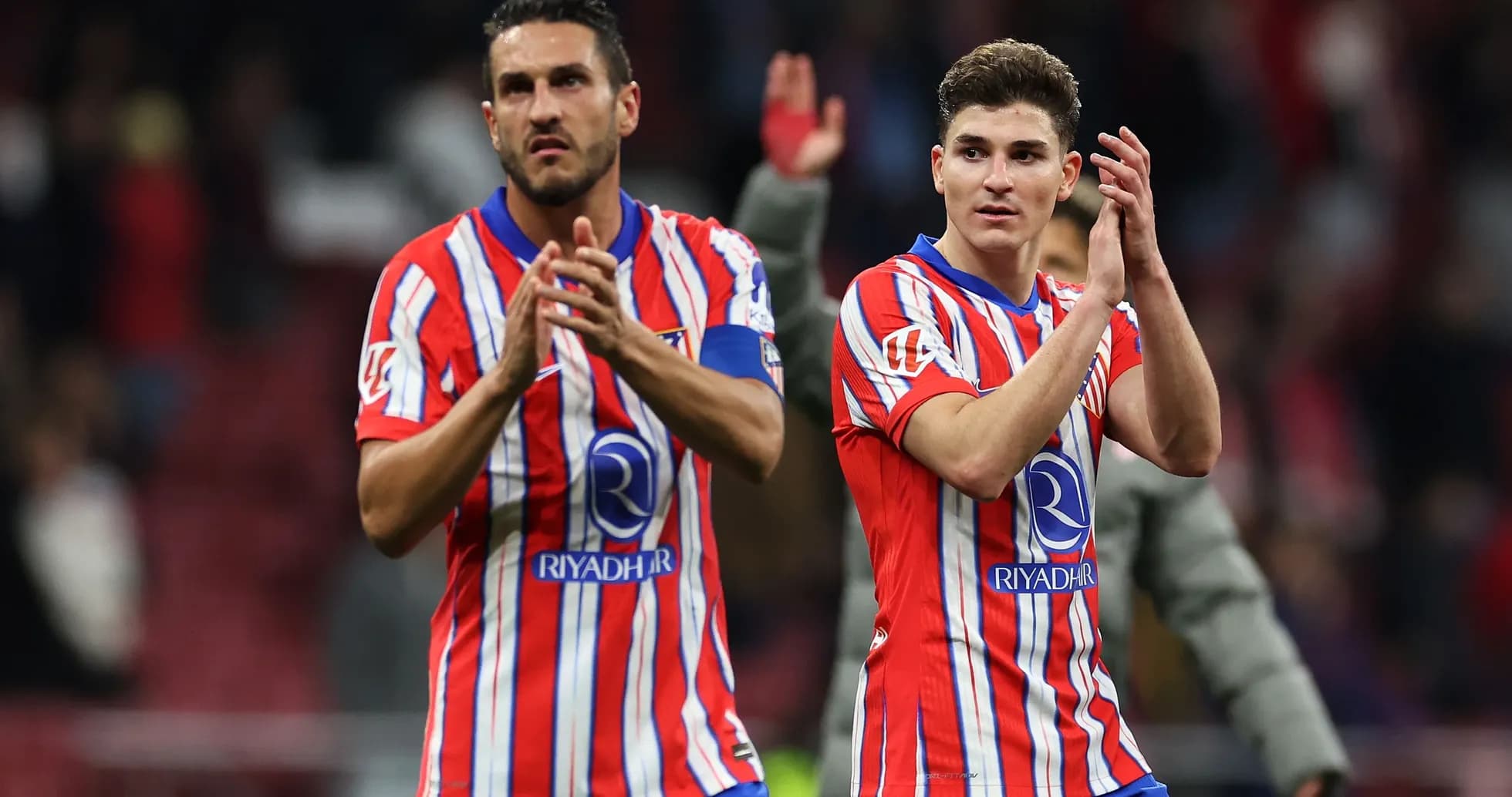 Two players applauding fans after match Two players applauding fans after match
