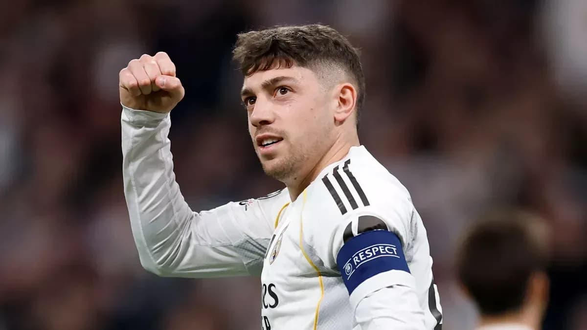 Player celebrating with fist raised during match Player celebrating with fist raised during match