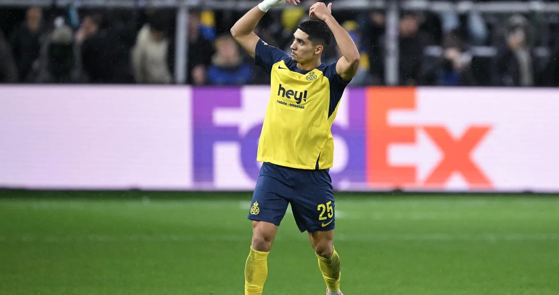 Player celebrating on the field during a match Player celebrating on the field during a match