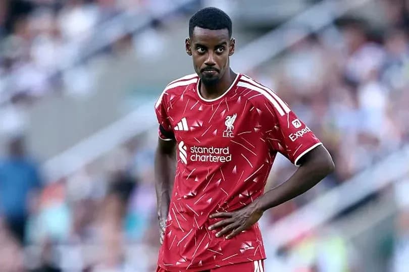 Player in Liverpool kit during match on field Player in Liverpool kit during match on field