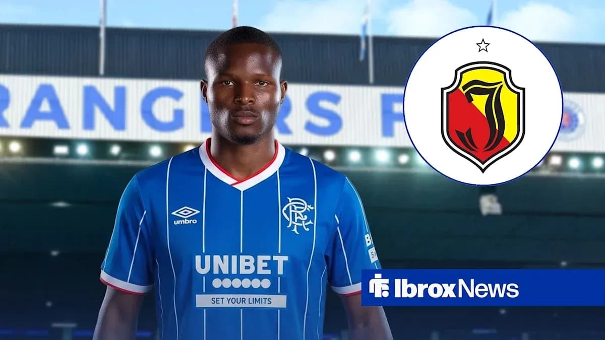 Player wearing Rangers FC jersey in front of stadium Player wearing Rangers FC jersey in front of stadium