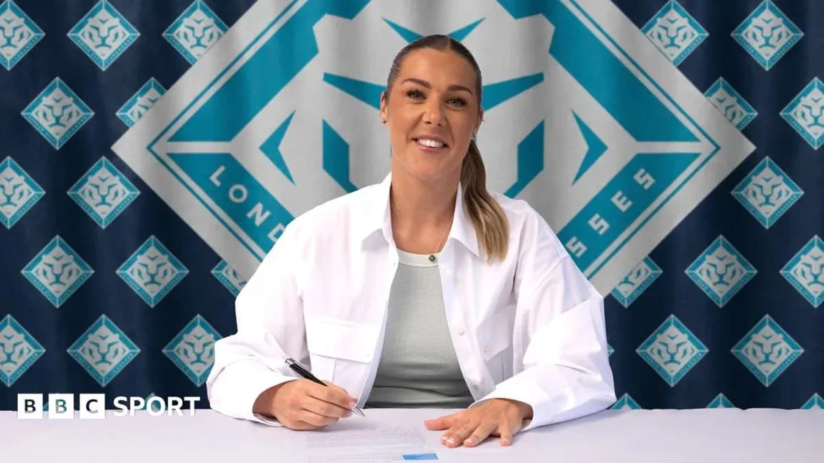 Player signing contract at press conference table Player signing contract at press conference table