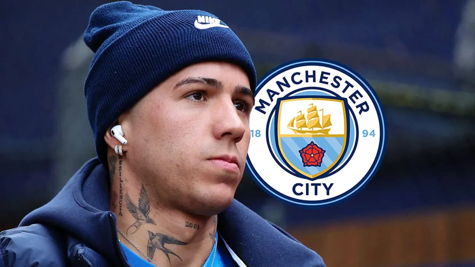 Player wearing headphones with Manchester City logo Player wearing headphones with Manchester City logo