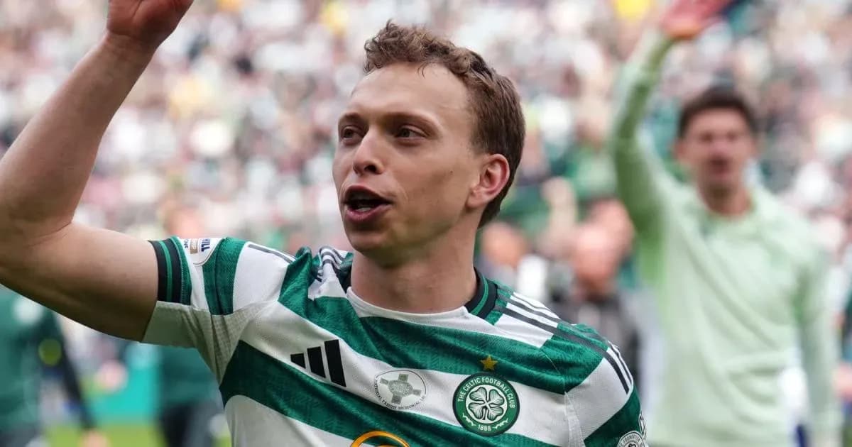 Celtic player celebrating with fans in stadium Celtic player celebrating with fans in stadium