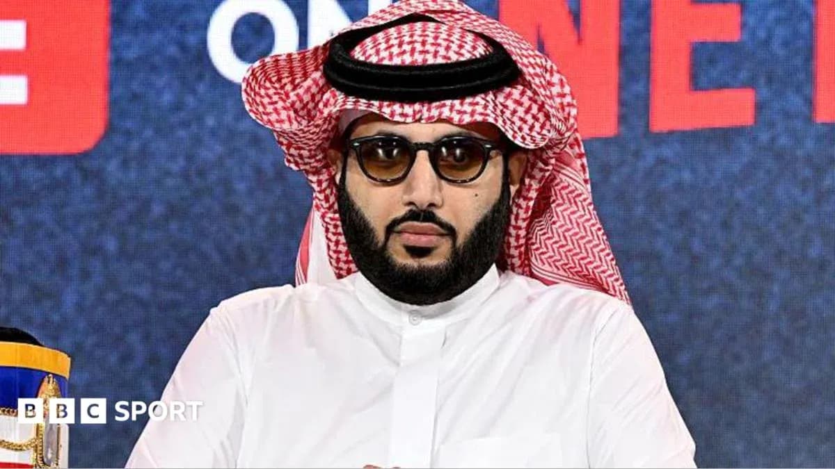 Man in traditional attire at press conference Man in traditional attire at press conference