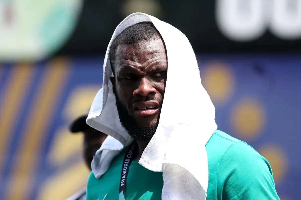 Player with towel on head during training session Player with towel on head during training session