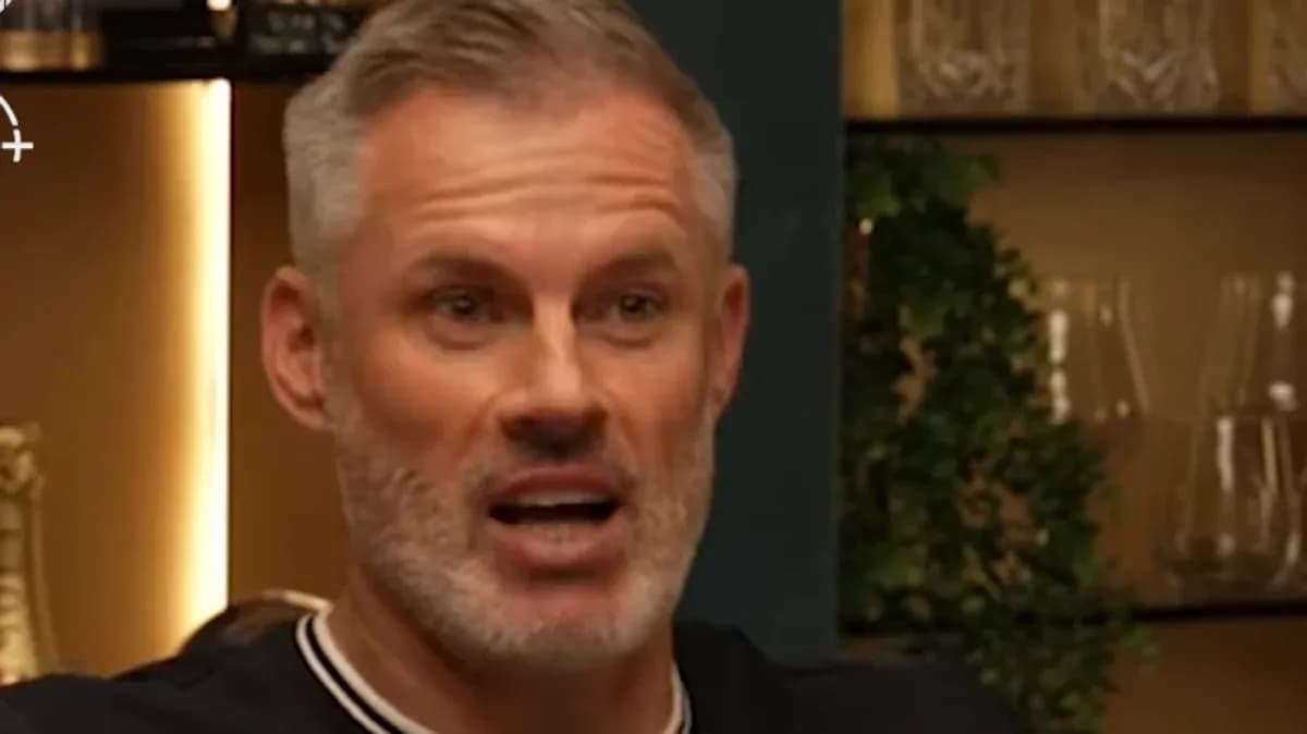 Man speaking during a discussion at a table Man speaking during a discussion at a table