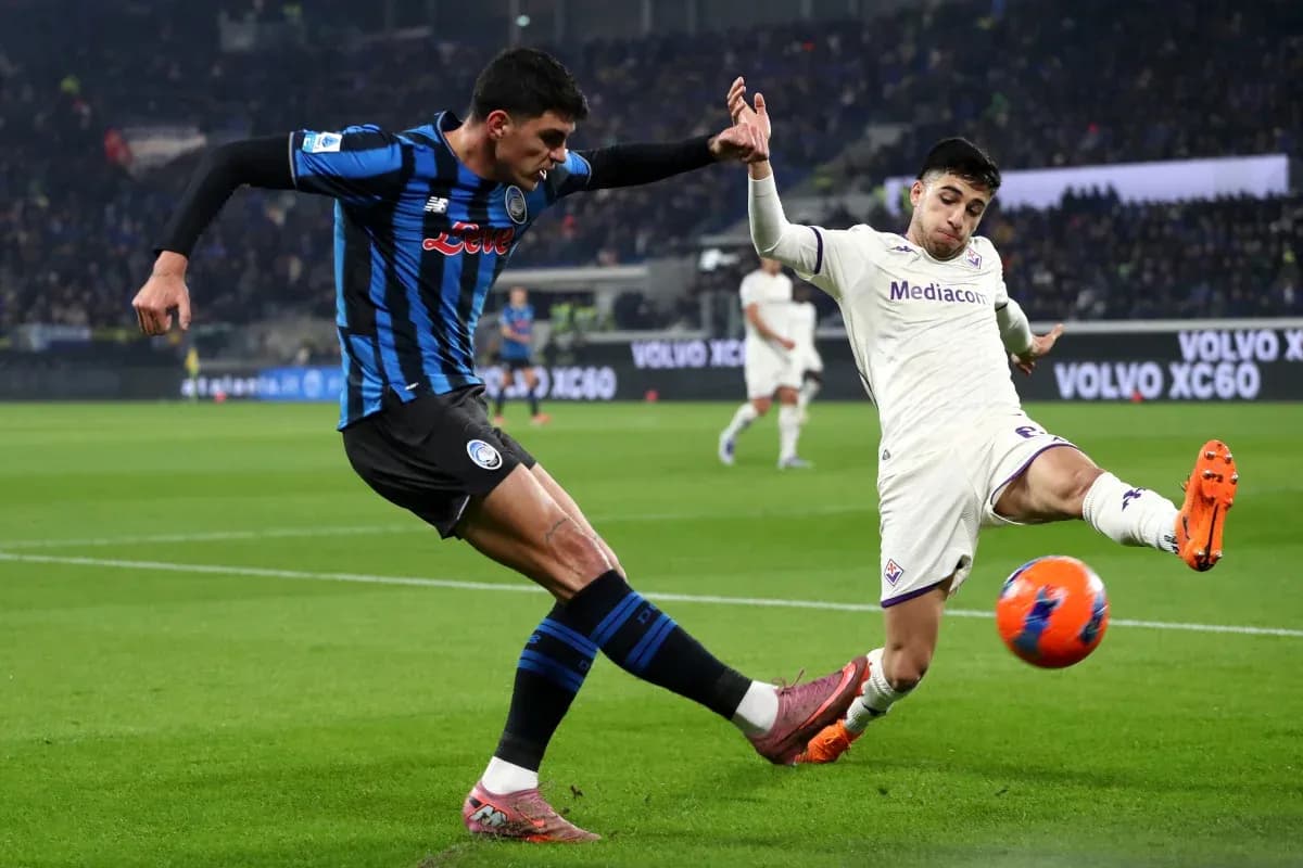 Fiorentina player challenges Atalanta opponent for the ball Fiorentina player challenges Atalanta opponent for the ball