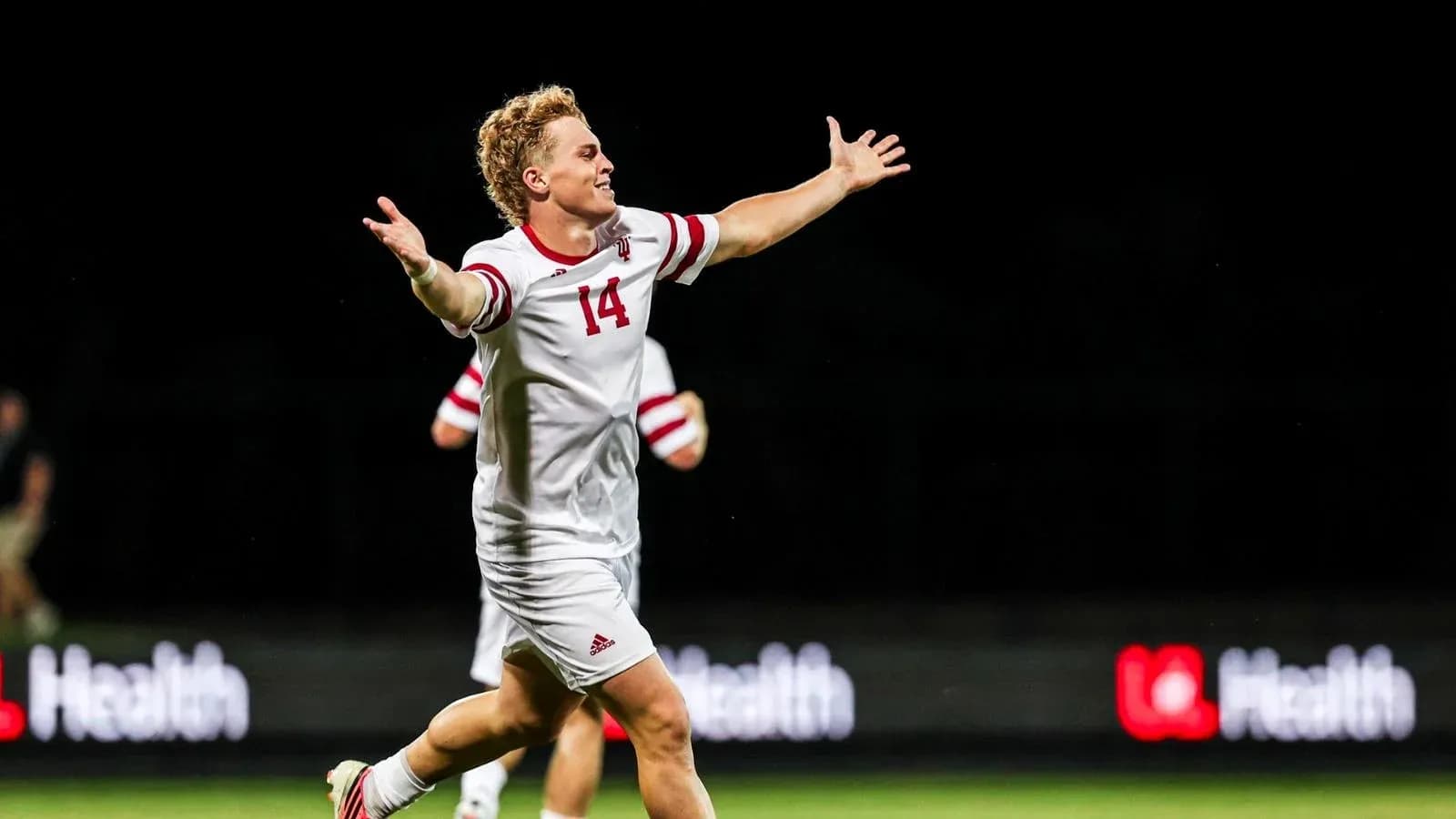 Player celebrating a goal on the field Player celebrating a goal on the field