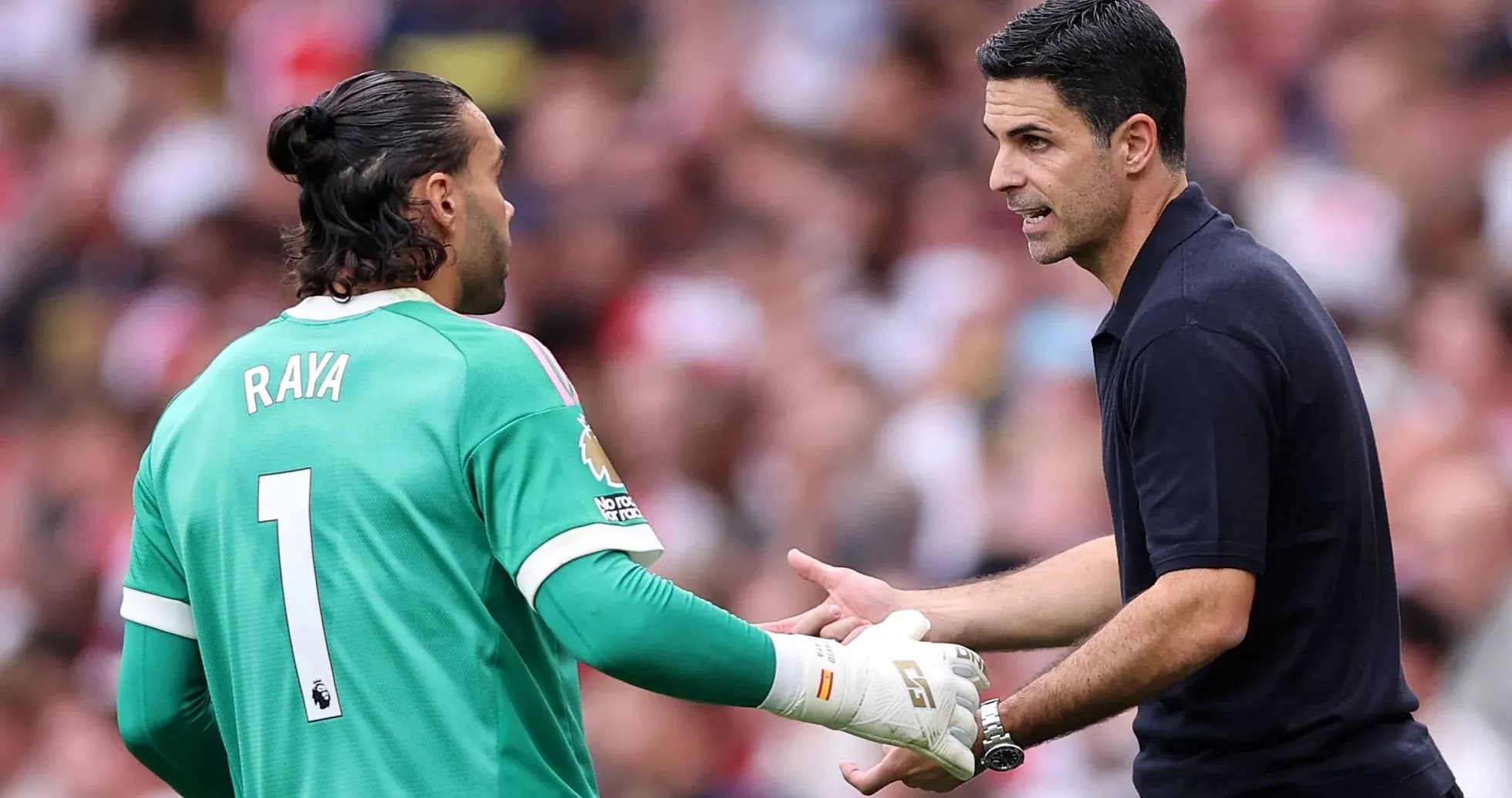 Goalkeeper conversing with manager on the field Goalkeeper conversing with manager on the field
