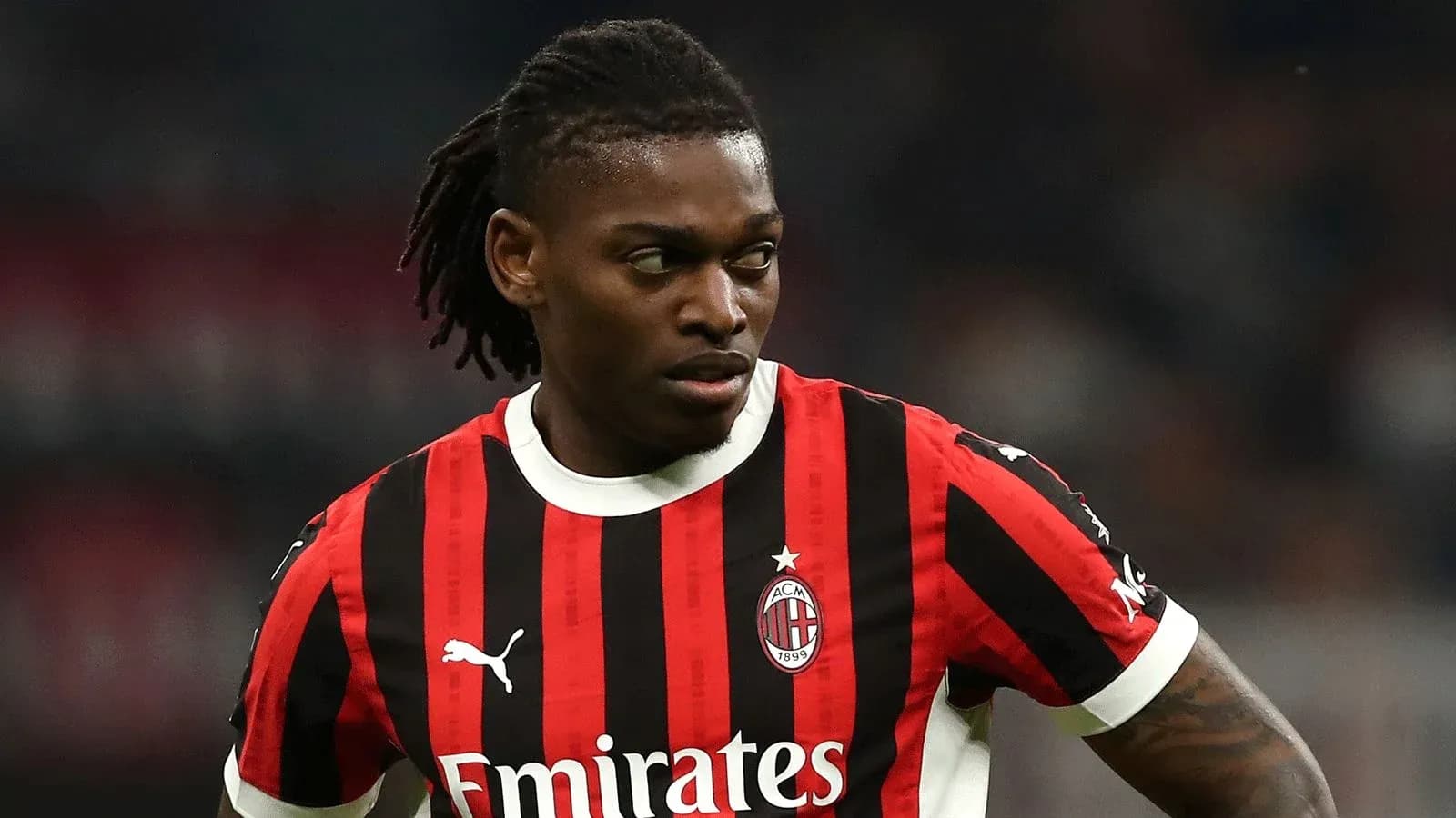 Player wearing AC Milan jersey during match Player wearing AC Milan jersey during match