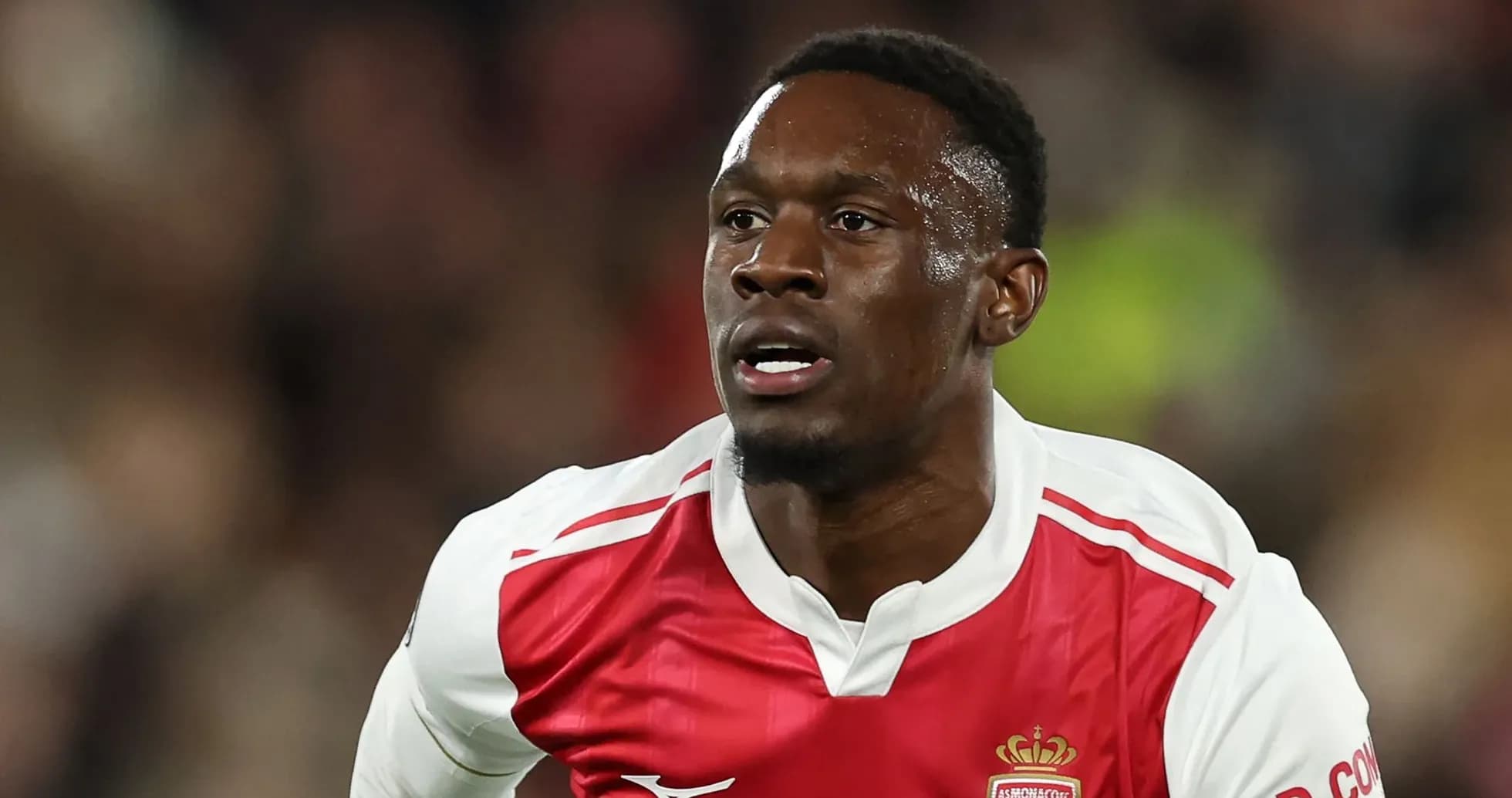 Player in AS Monaco kit running during match Player in AS Monaco kit running during match