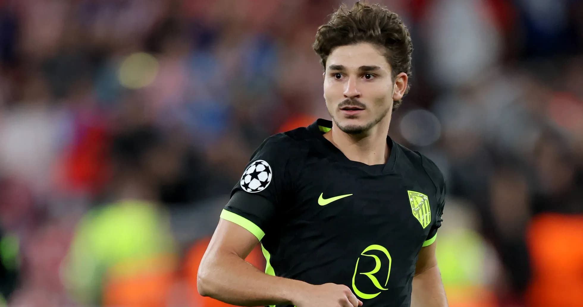 Player in black jersey during Champions League match Player in black jersey during Champions League match