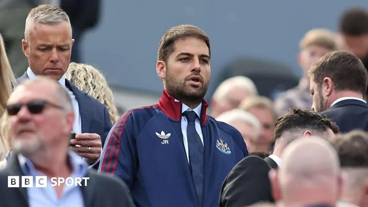 Man in Newcastle tracksuit among crowd at event Man in Newcastle tracksuit among crowd at event