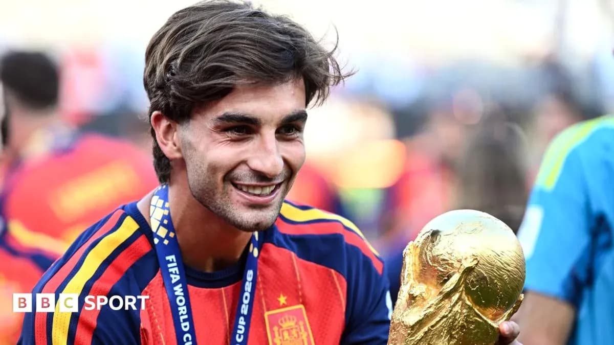 Player celebrating with FIFA World Cup trophy Player celebrating with FIFA World Cup trophy