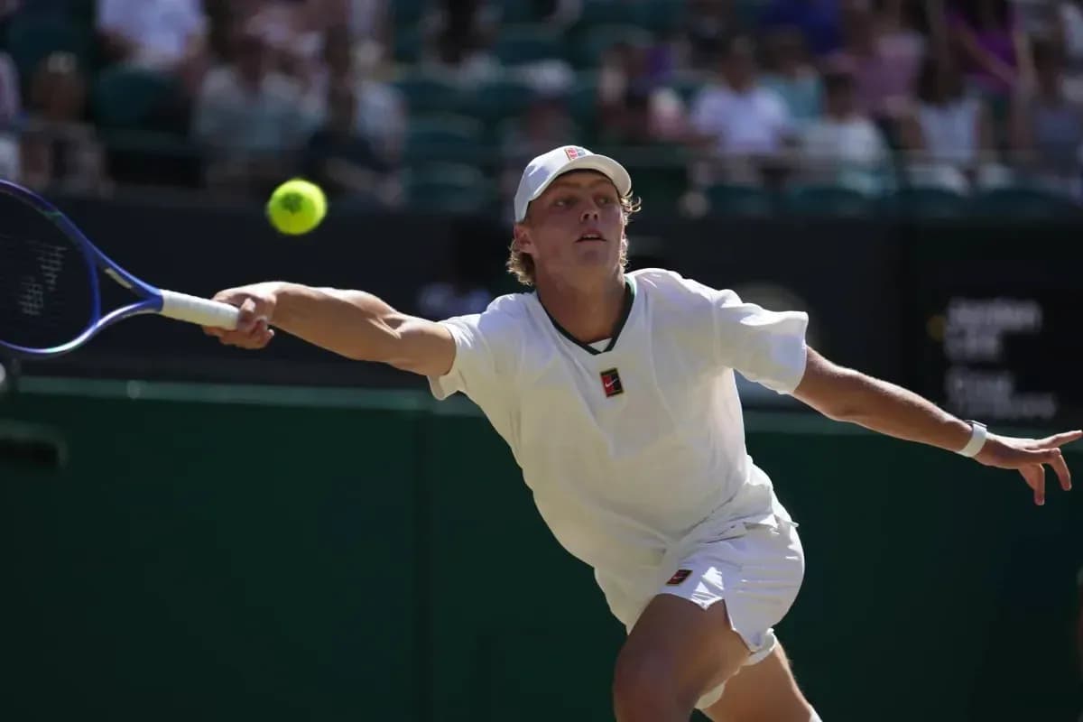 Tennis player reaching for a ball during match Tennis player reaching for a ball during match