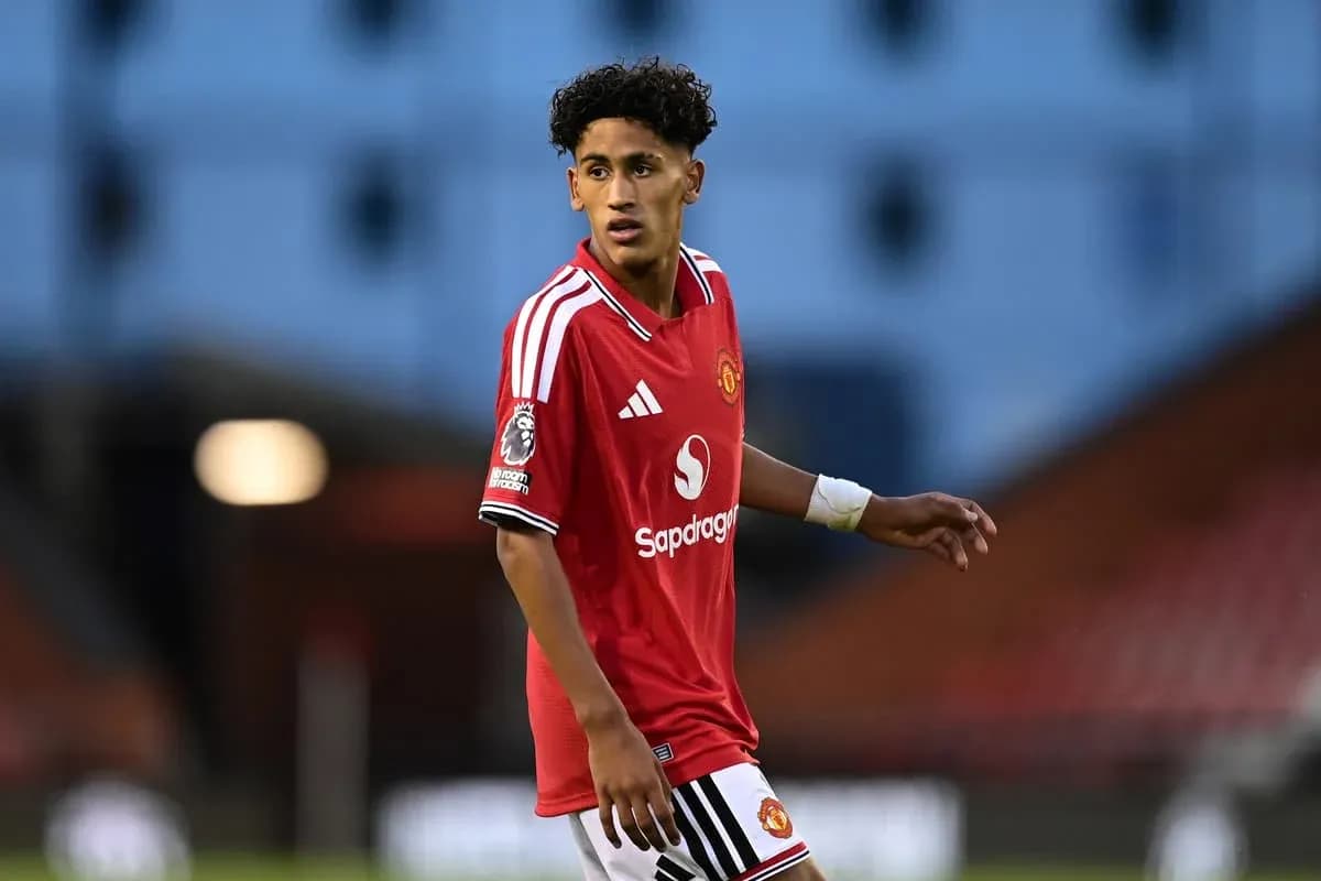Player wearing Manchester United kit on the field Player wearing Manchester United kit on the field
